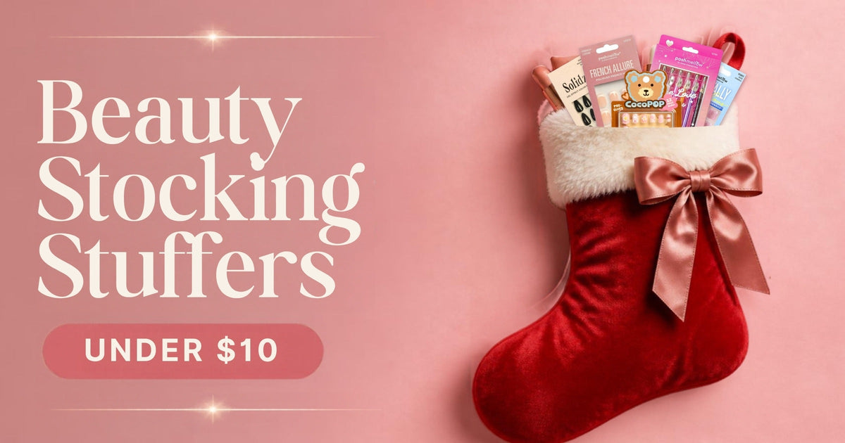 Red Christmas stocking filled with Poshmellow press-on nails and eyeliners, beauty stocking stuffers under $10